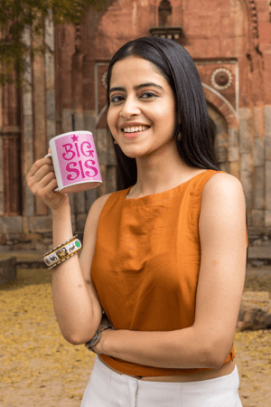 11-oz-coffee-mug-mockup-featuring-a-smiling-woman-by-an-antique-building-m25869-5-1
