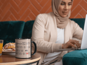 11-oz-coffee-mug-mockup-featuring-a-woman-working-on-the-computer-32405-1