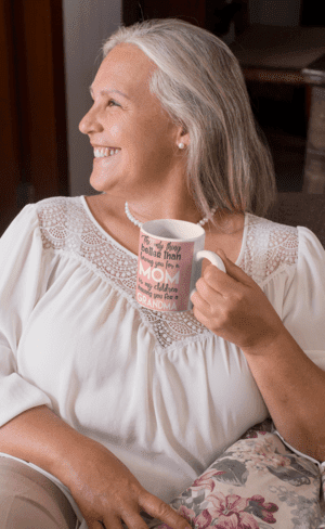 11-oz-coffee-mug-mockup-of-a-happy-grandma-at-her-living-room-27448-1-1