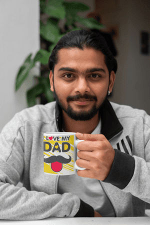 11-oz-coffee-mug-mockup-of-a-man-with-a-plant-in-the-background-29110-1