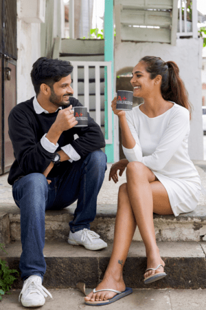 11-oz-mug-mockup-of-a-couple-having-a-coffee-outside-their-house-m26340-1