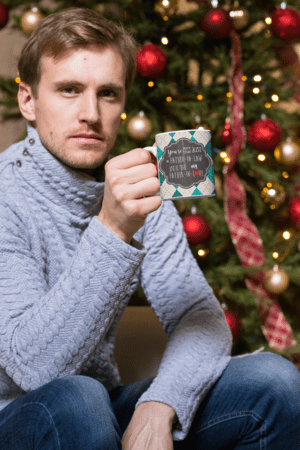 11-oz-mug-mockup-of-a-man-having-a-coffee-by-a-christmas-tree-30176-16-1