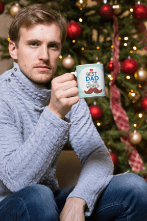 11-oz-mug-mockup-of-a-man-having-a-coffee-by-a-christmas-tree-30176-2-1