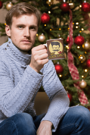 11-oz-mug-mockup-of-a-man-having-a-coffee-by-a-christmas-tree-30176-22-1