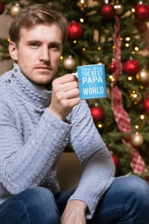 11-oz-mug-mockup-of-a-man-having-a-coffee-by-a-christmas-tree-30176-4-1