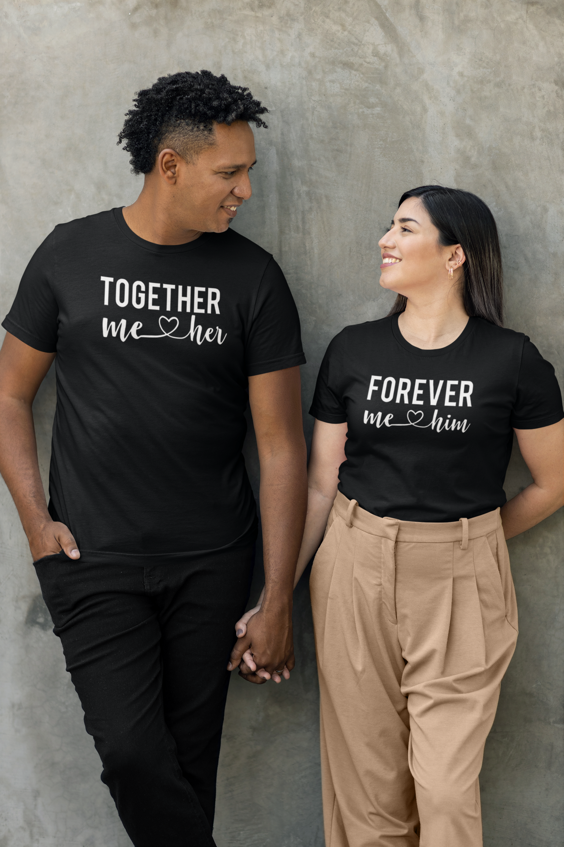 bella-canvas-t-shirt-mockup-of-a-happy-man-holding-hands-with-a-woman-against-a-wall-m36307