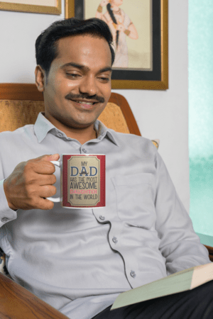 coffee-mug-mockup-featuring-a-man-reading-a-book-at-home-m29669-7-1