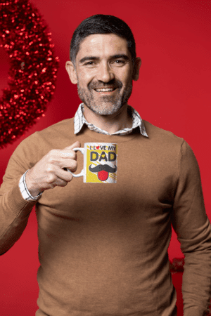 coffee-mug-mockup-featuring-a-middle-aged-man-in-a-christmas-setting-m18350-14-1