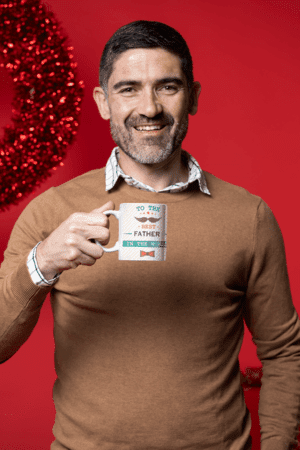 coffee-mug-mockup-featuring-a-middle-aged-man-in-a-christmas-setting-m18350-2-1
