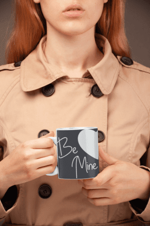 coffee-mug-mockup-held-by-a-woman-wearing-a-trench-coat-22378-1