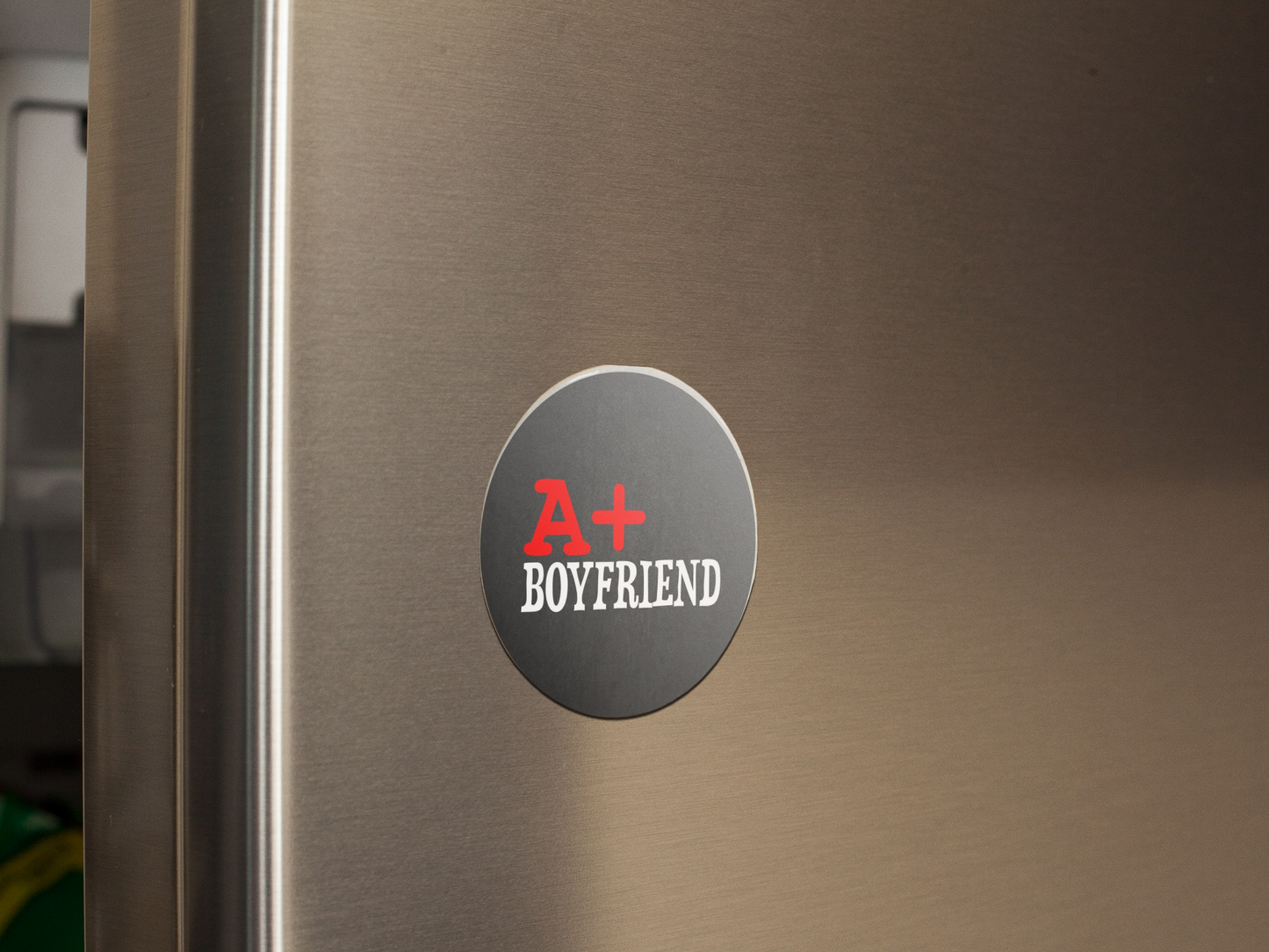 fridge-magnet-mockup-on-a-metallic-fridge-door-a14799