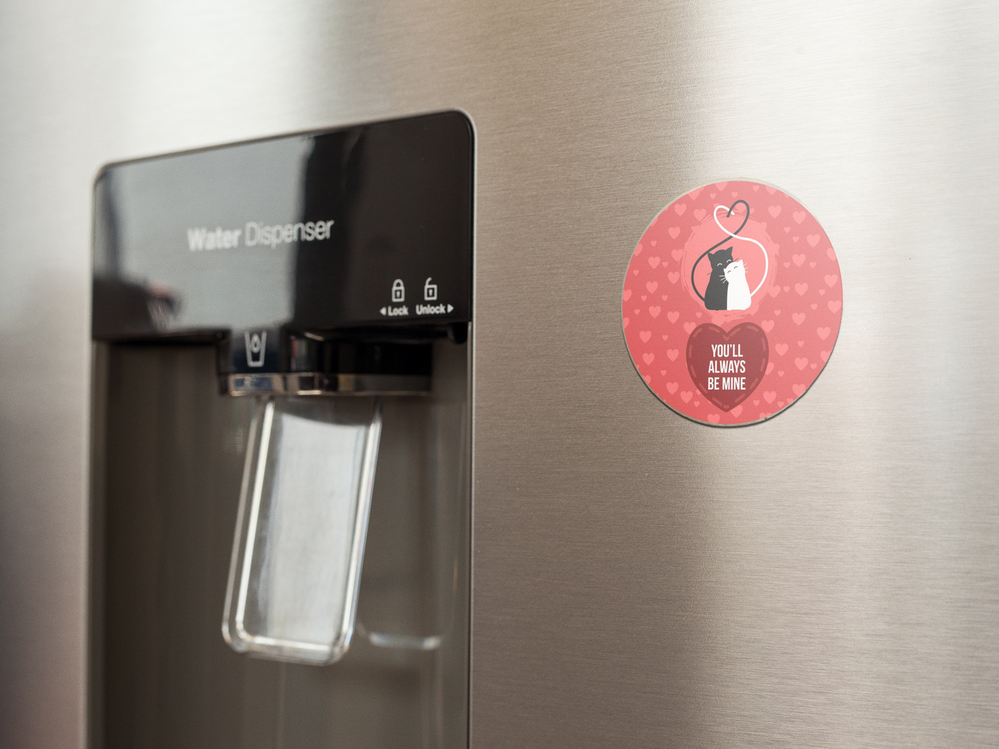 fridge-magnet-mockup-on-a-metallic-fridge-near-the-water-dispenser-a14790 (1)