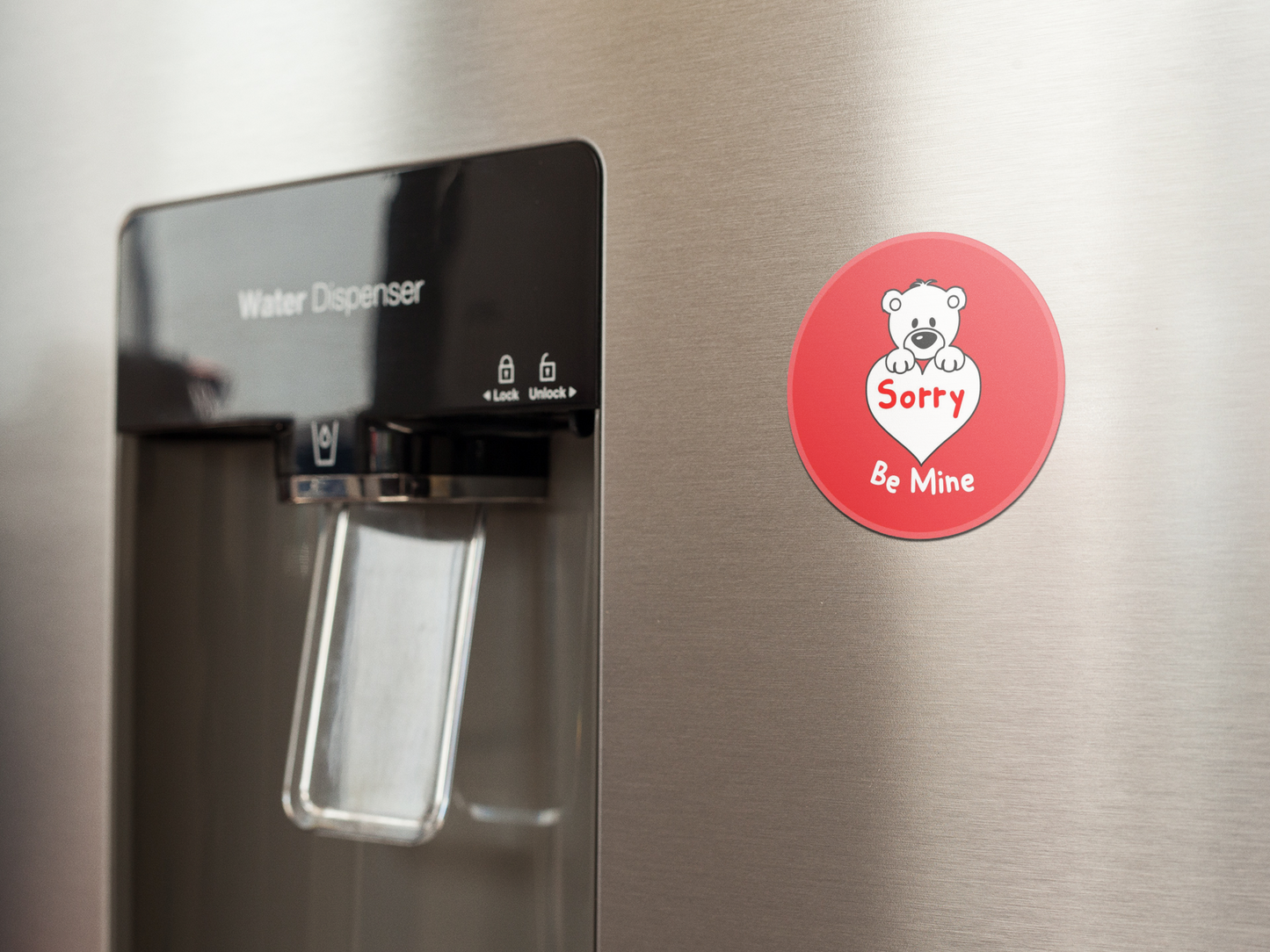 fridge-magnet-mockup-on-a-metallic-fridge-near-the-water-dispenser-a14790 (1)