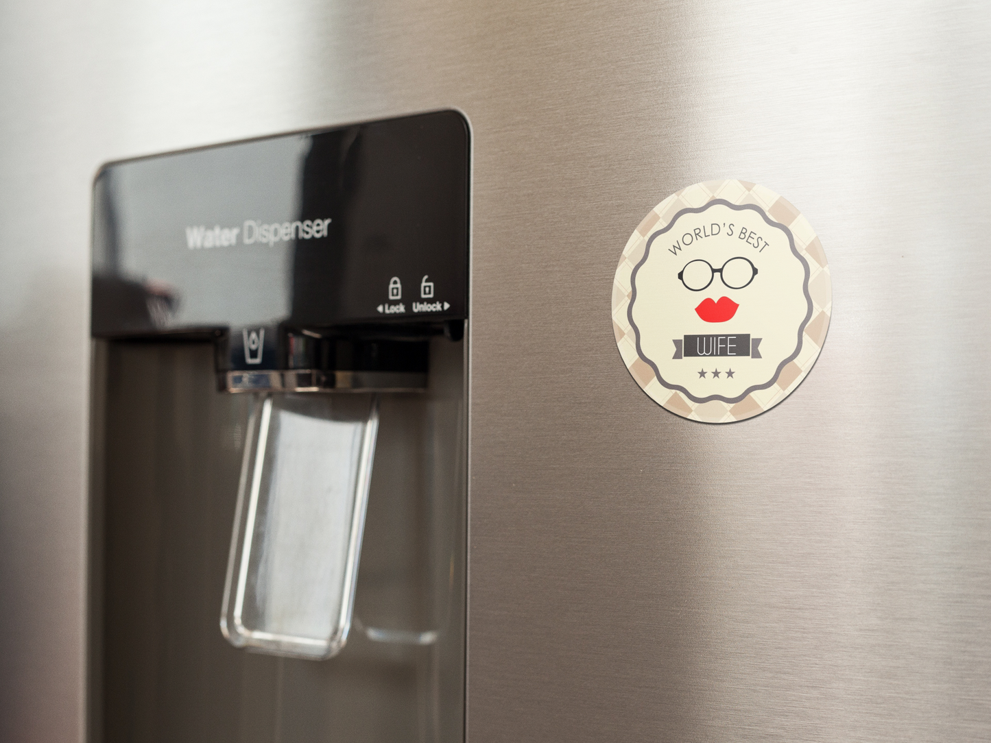 fridge-magnet-mockup-on-a-metallic-fridge-near-the-water-dispenser-a14790