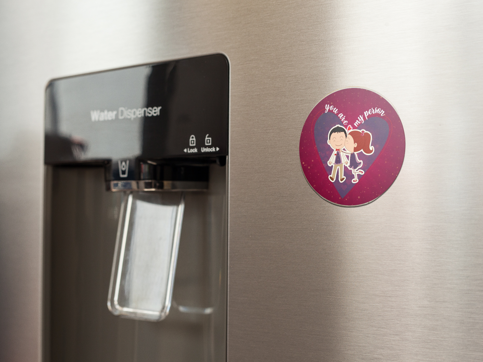 fridge-magnet-mockup-on-a-metallic-fridge-near-the-water-dispenser-a14790