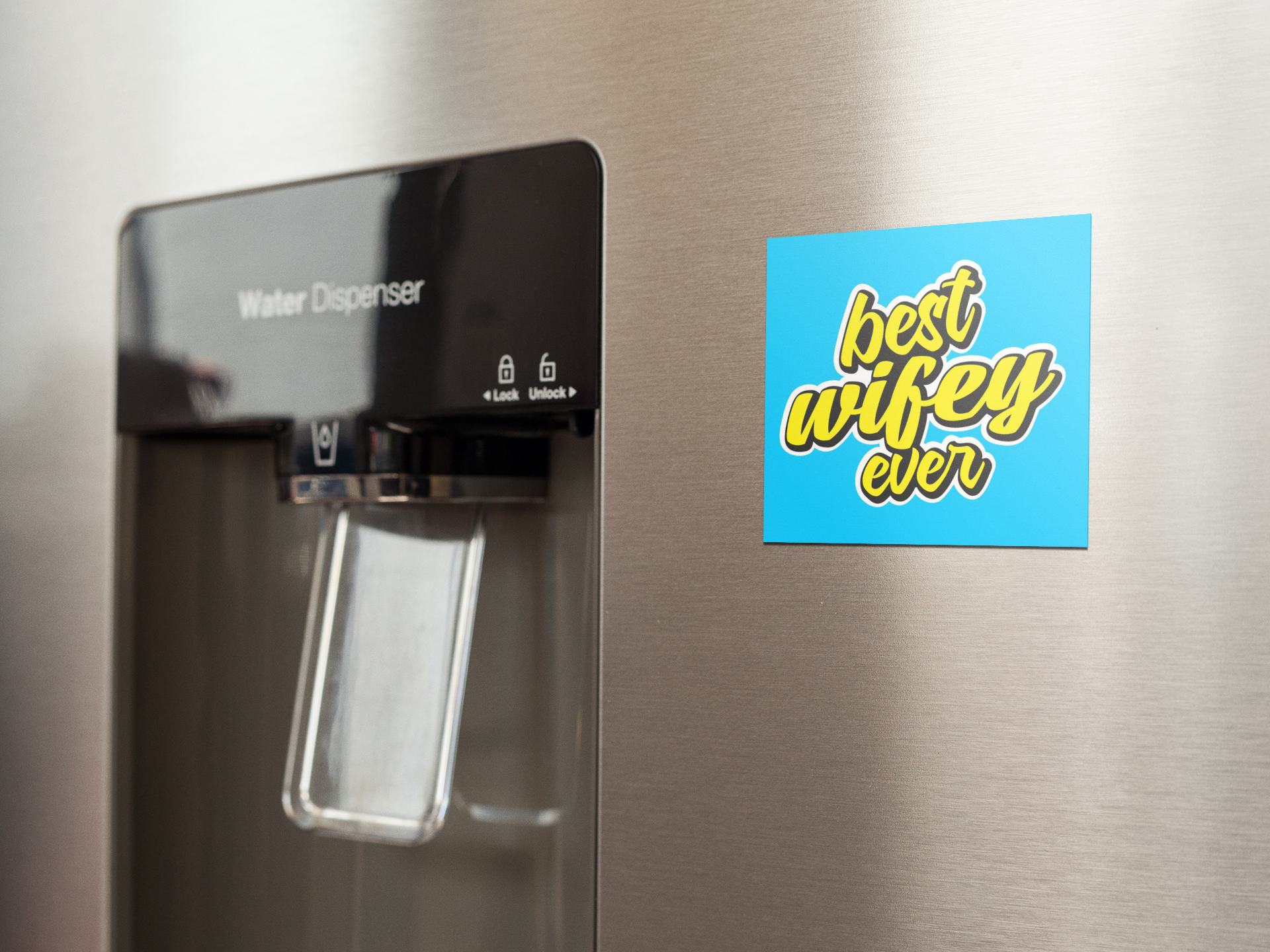 fridge-magnet-mockup-on-a-metallic-fridge-near-the-water-dispenser-a14790