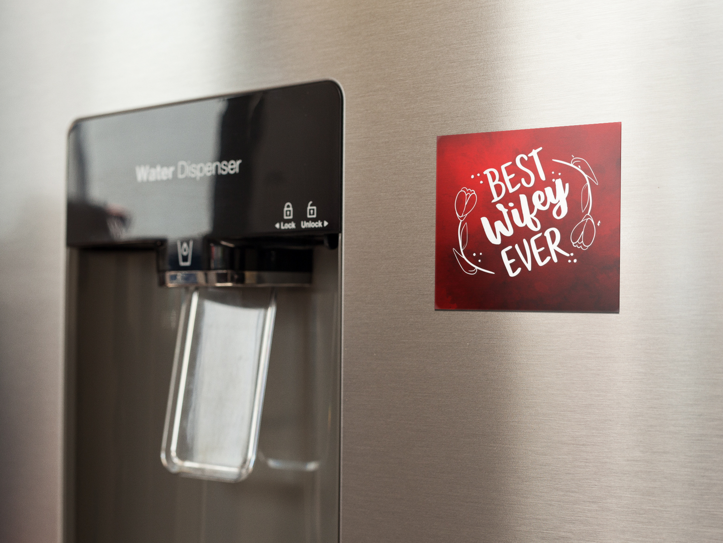 fridge-magnet-mockup-on-a-metallic-fridge-near-the-water-dispenser-a14790