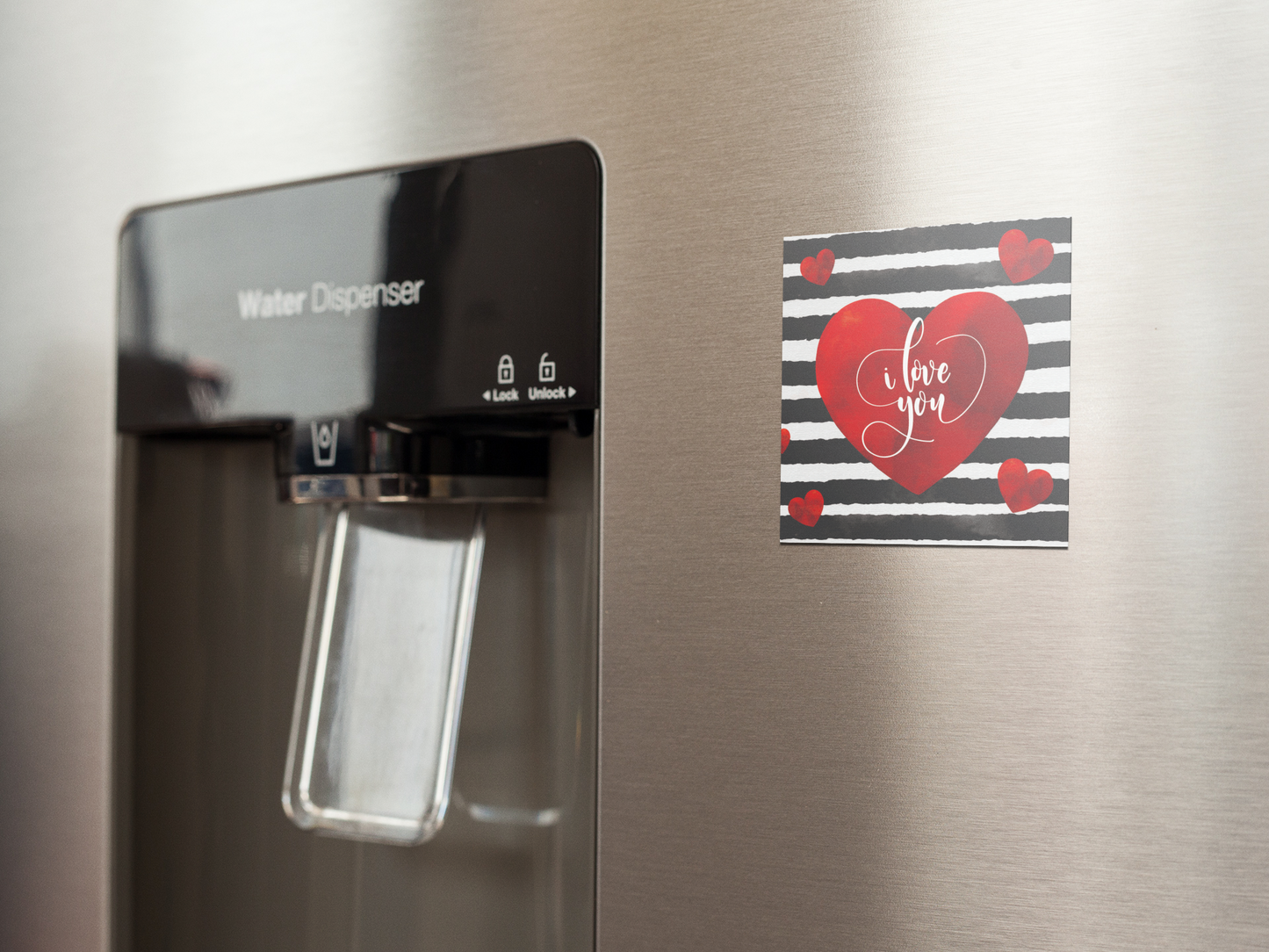 fridge-magnet-mockup-on-a-metallic-fridge-near-the-water-dispenser-a14790