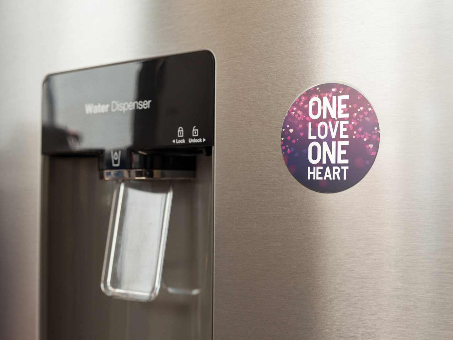 fridge-magnet-mockup-on-a-metallic-fridge-near-the-water-dispenser-a14790