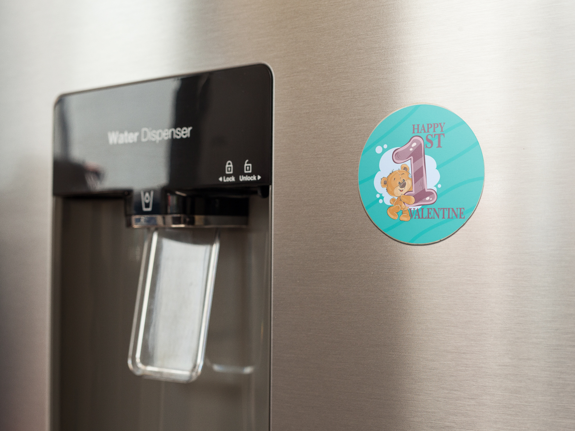 fridge-magnet-mockup-on-a-metallic-fridge-near-the-water-dispenser-a14790