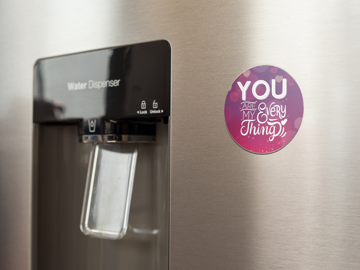 fridge-magnet-mockup-on-a-metallic-fridge-near-the-water-dispenser-a14790