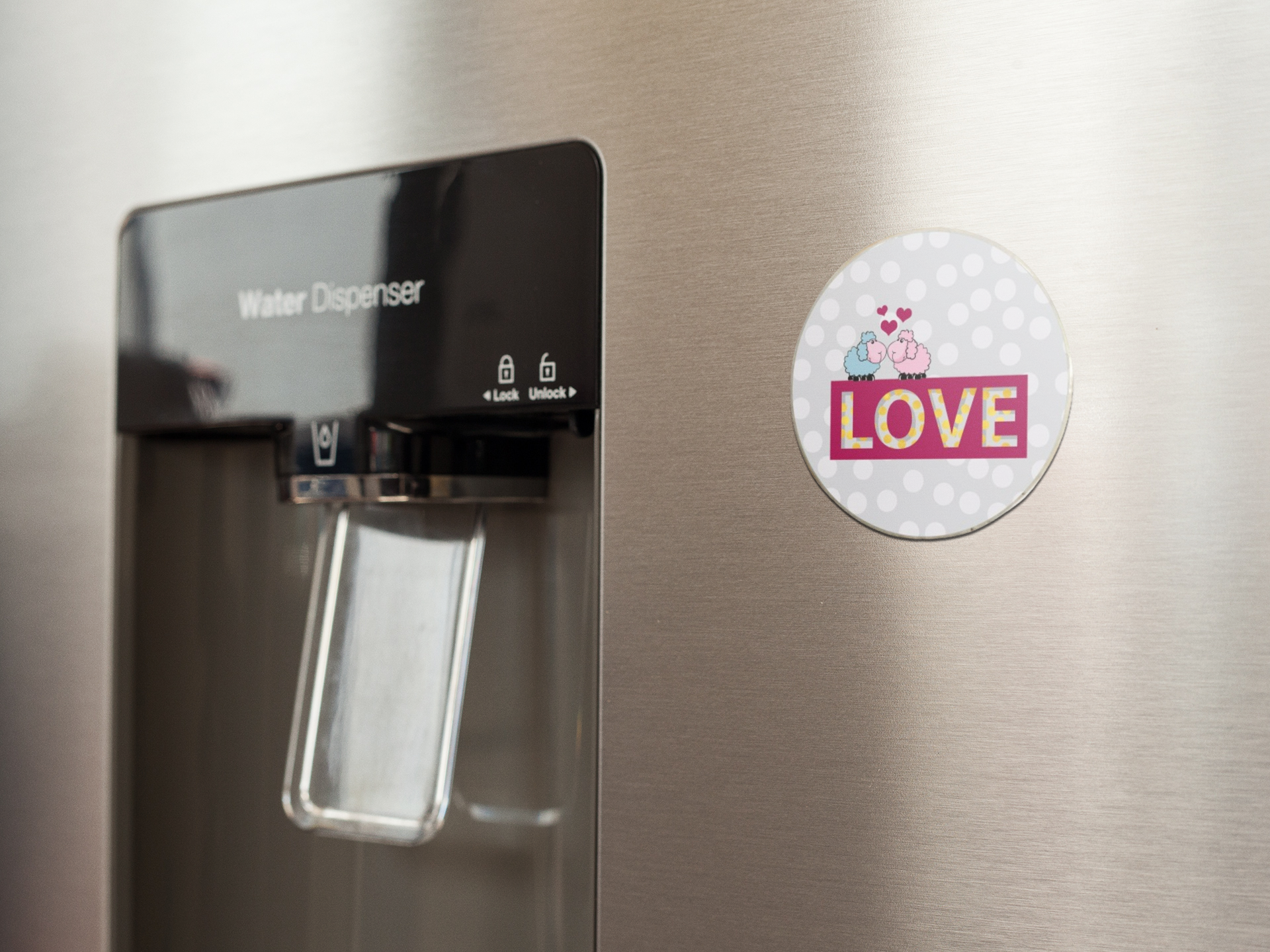 fridge-magnet-mockup-on-a-metallic-fridge-near-the-water-dispenser-a14790