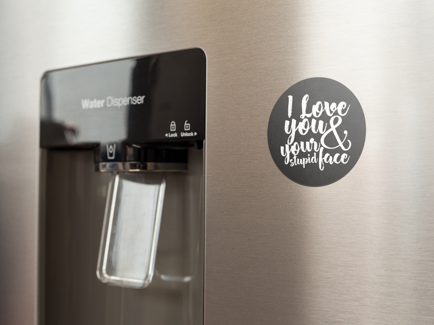 fridge-magnet-mockup-on-a-metallic-fridge-near-the-water-dispenser-a14790