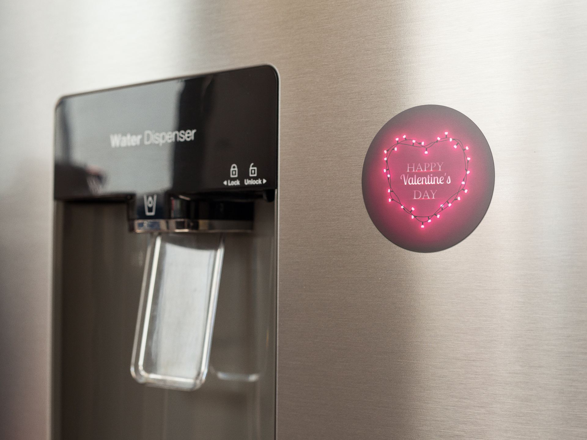 fridge-magnet-mockup-on-a-metallic-fridge-near-the-water-dispenser-a14790