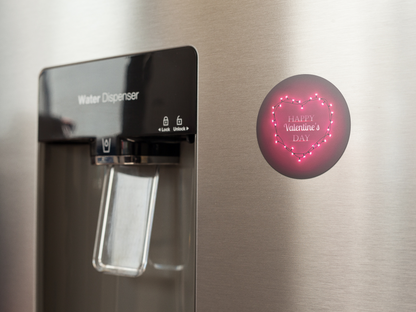 fridge-magnet-mockup-on-a-metallic-fridge-near-the-water-dispenser-a14790