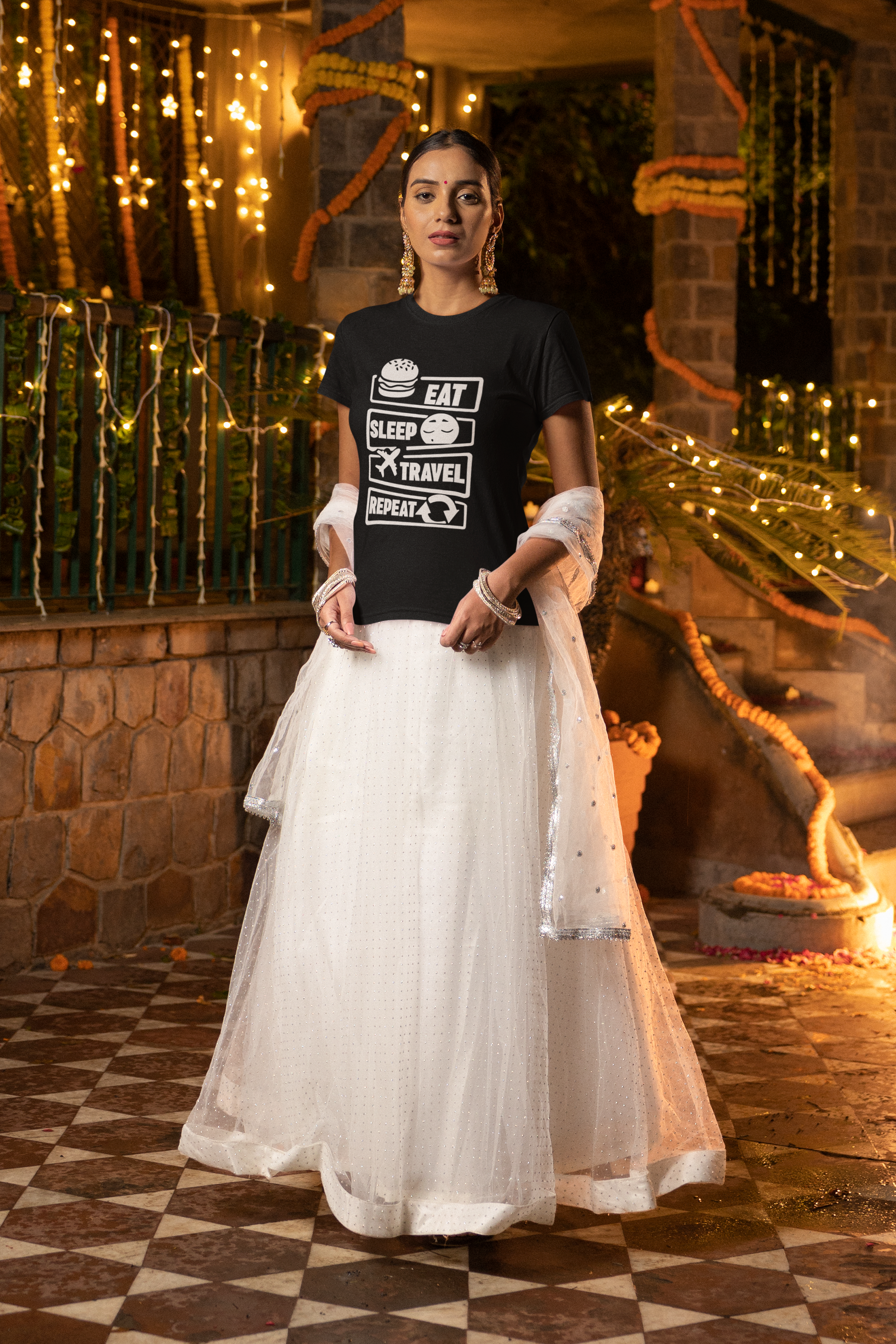 gildan-tee-mockup-of-a-woman-standing-in-a-diwali-decorated-garden-m36015