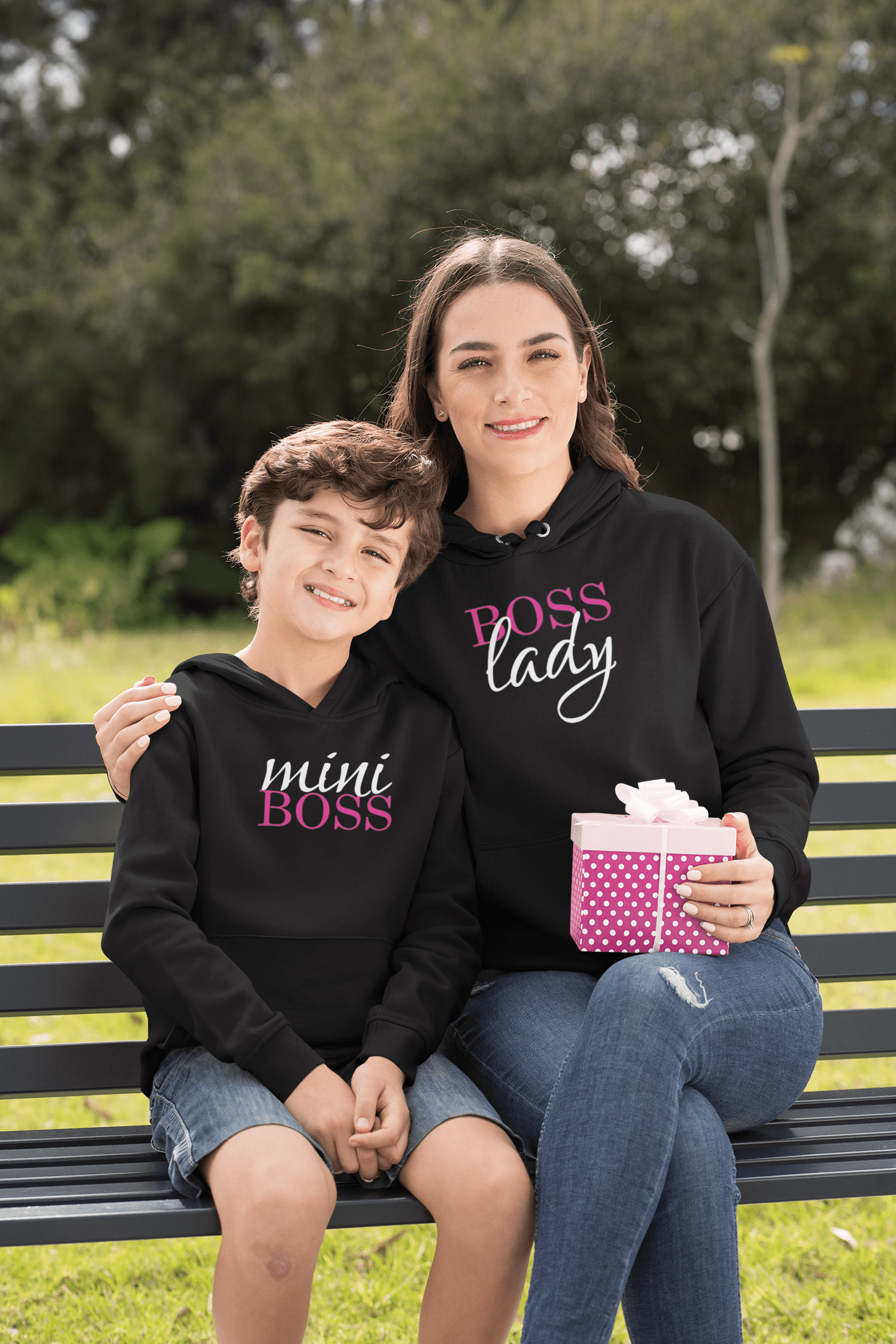 hoodie-mockup-of-a-boy-and-his-mom-sitting-on-a-park-bench-32636-1.png