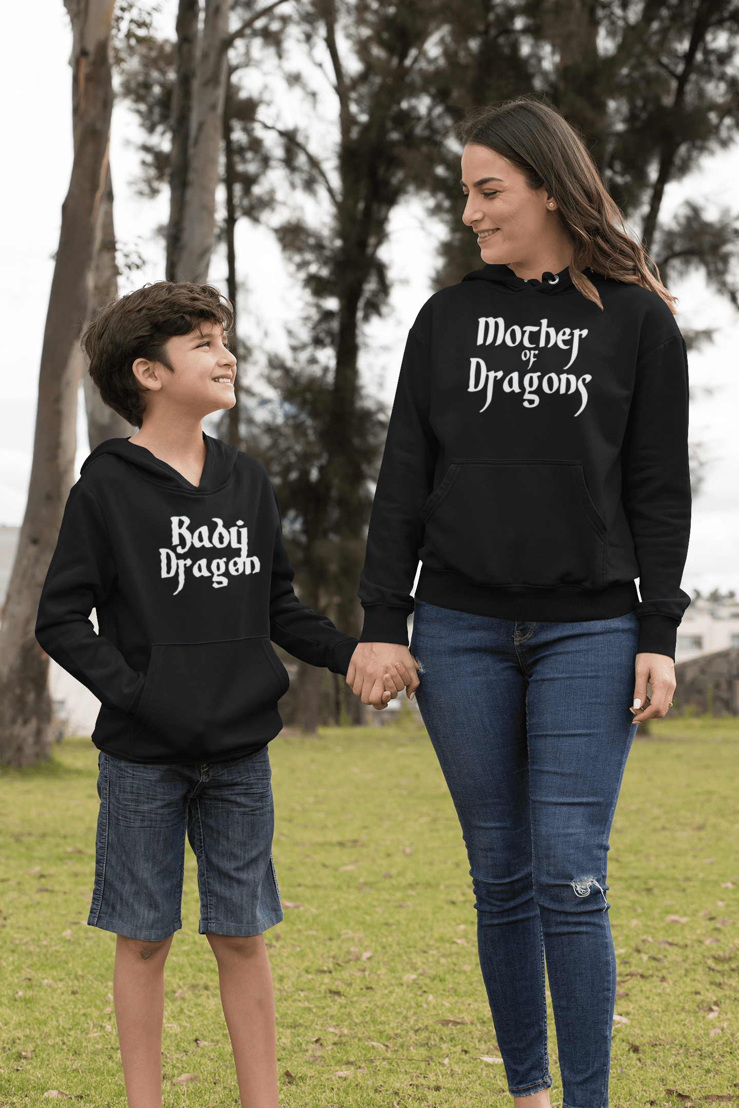 hoodie-mockup-of-a-mom-and-her-son-holding-hands-in-the-park-32635.png