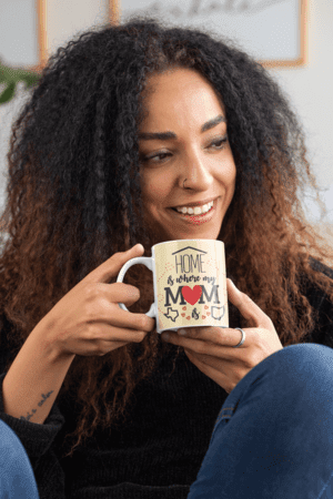 mockup-of-a-curly-haired-woman-with-an-11-oz-mug-in-her-hands-33174-1