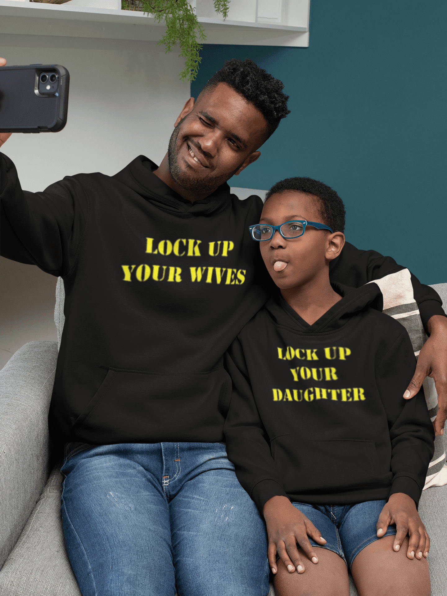 mockup-of-a-dad-and-kid-with-hoodies-taking-a-selfie-33113.png