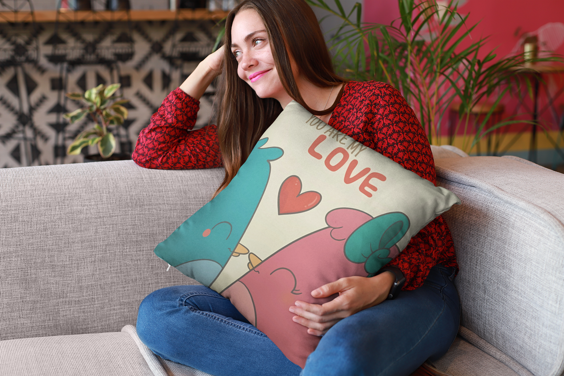 mockup-of-a-happy-girl-holding-a-pillow-sitting-on-a-sofa-23607 (1)