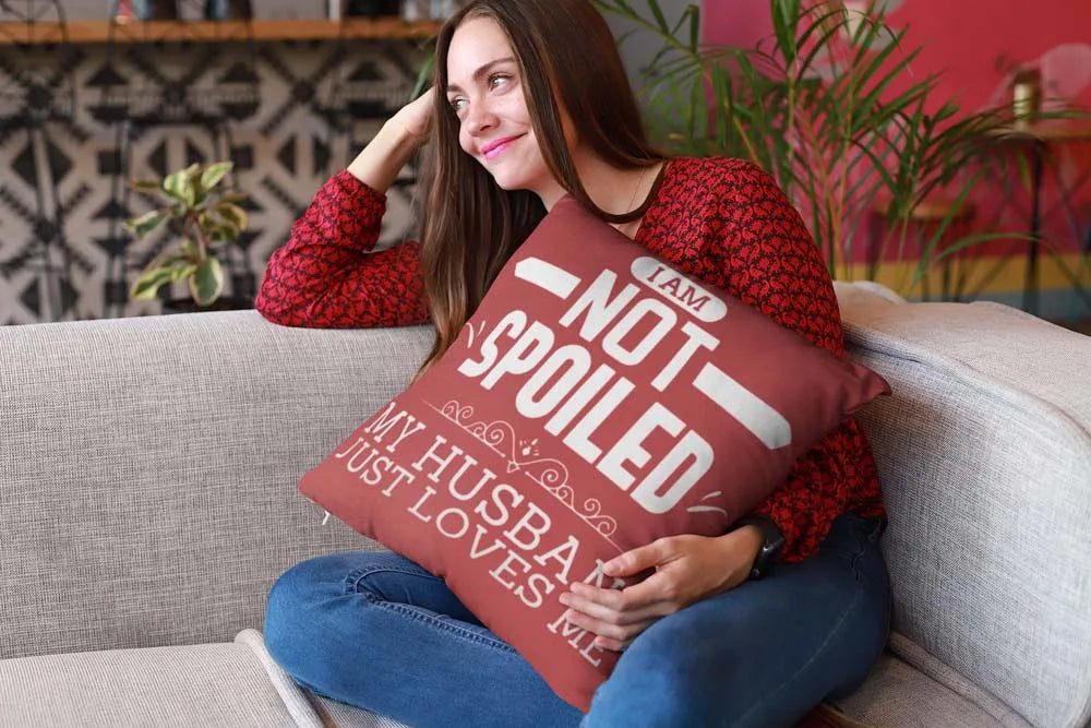 mockup-of-a-happy-girl-holding-a-pillow-sitting-on-a-sofa-23607