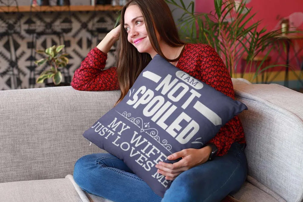 mockup-of-a-happy-girl-holding-a-pillow-sitting-on-a-sofa-23607