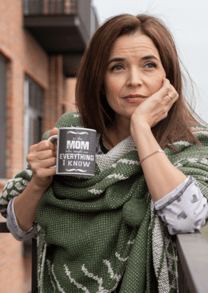 mockup-of-a-middle-aged-woman-holding-an-11-oz-coffee-mug-outside-31600-3-1