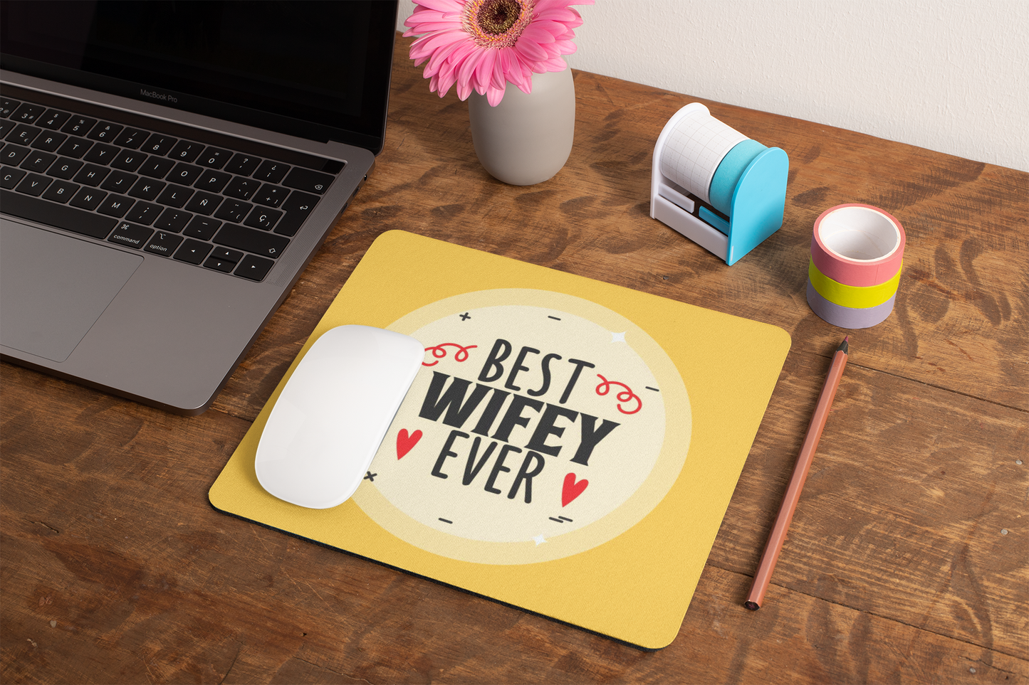 mockup-of-a-mousepad-lying-on-a-rustic-table-next-to-a-flower-vase-27554 (1)