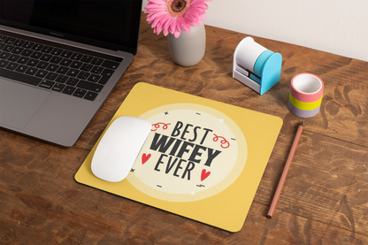 mockup-of-a-mousepad-lying-on-a-rustic-table-next-to-a-flower-vase-27554 (1)