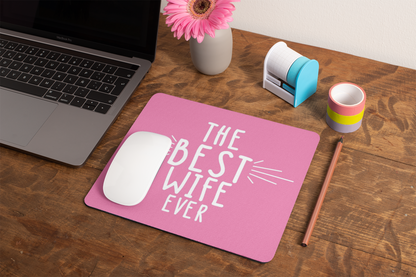 mockup-of-a-mousepad-lying-on-a-rustic-table-next-to-a-flower-vase-27554