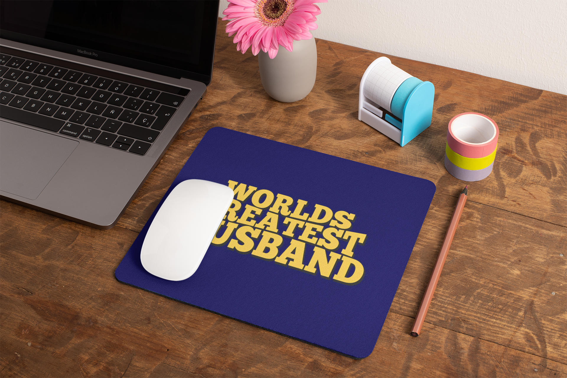 mockup-of-a-mousepad-lying-on-a-rustic-table-next-to-a-flower-vase-27554