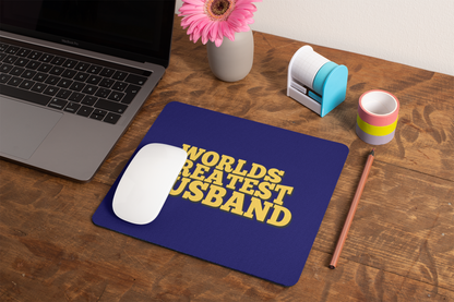 mockup-of-a-mousepad-lying-on-a-rustic-table-next-to-a-flower-vase-27554