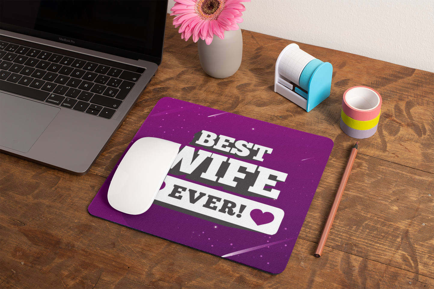 mockup-of-a-mousepad-lying-on-a-rustic-table-next-to-a-flower-vase-27554