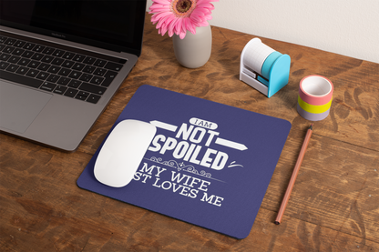 mockup-of-a-mousepad-lying-on-a-rustic-table-next-to-a-flower-vase-27554