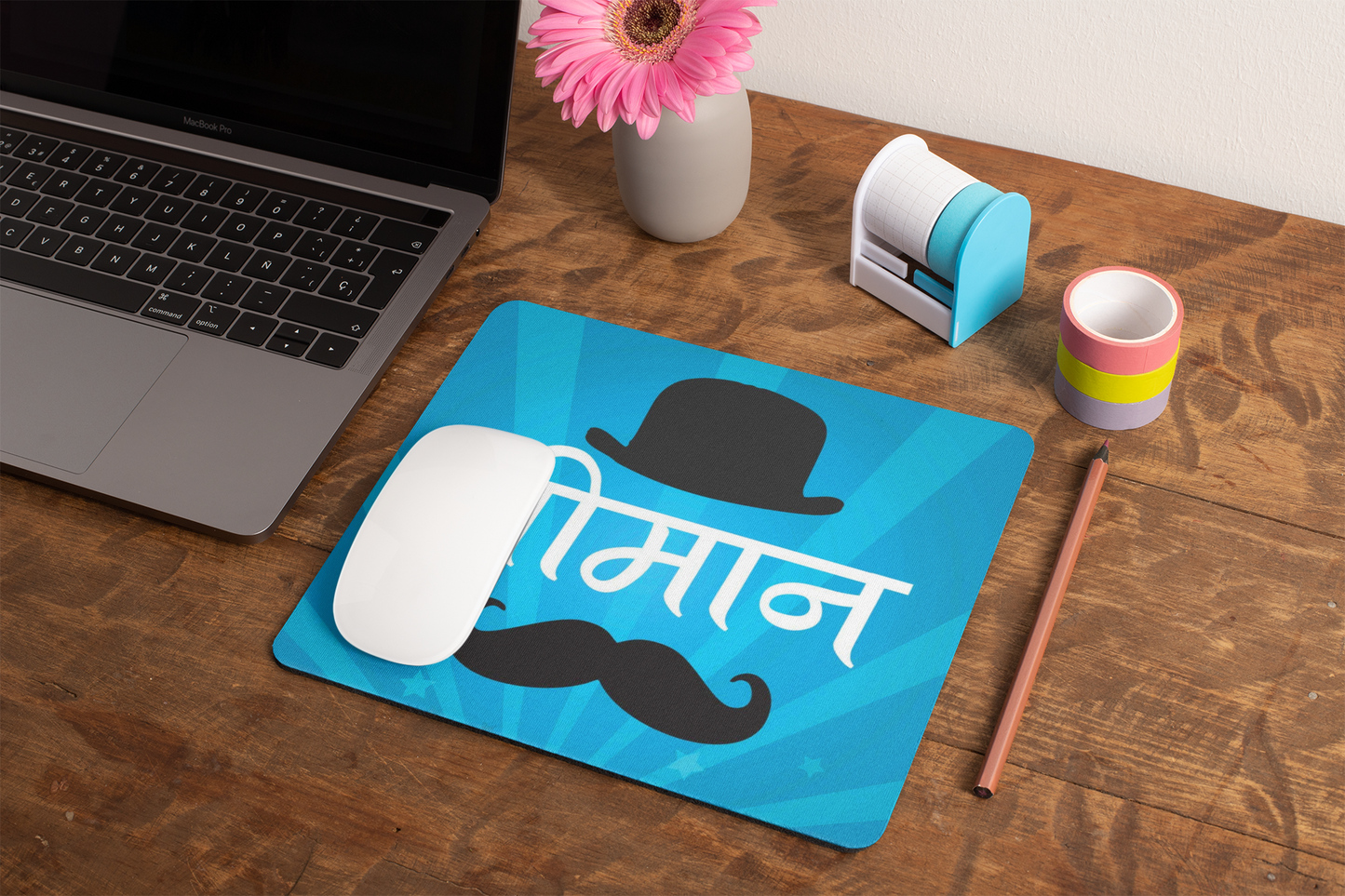 mockup-of-a-mousepad-lying-on-a-rustic-table-next-to-a-flower-vase-27554