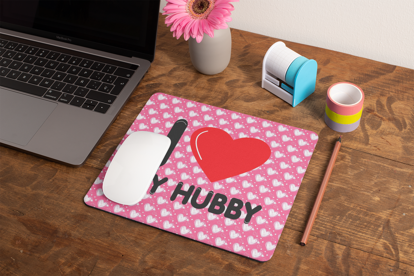 mockup-of-a-mousepad-lying-on-a-rustic-table-next-to-a-flower-vase-27554