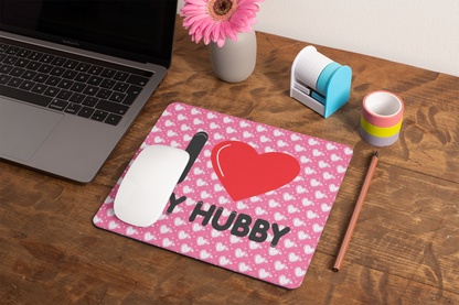 mockup-of-a-mousepad-lying-on-a-rustic-table-next-to-a-flower-vase-27554