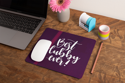 mockup-of-a-mousepad-lying-on-a-rustic-table-next-to-a-flower-vase-27554