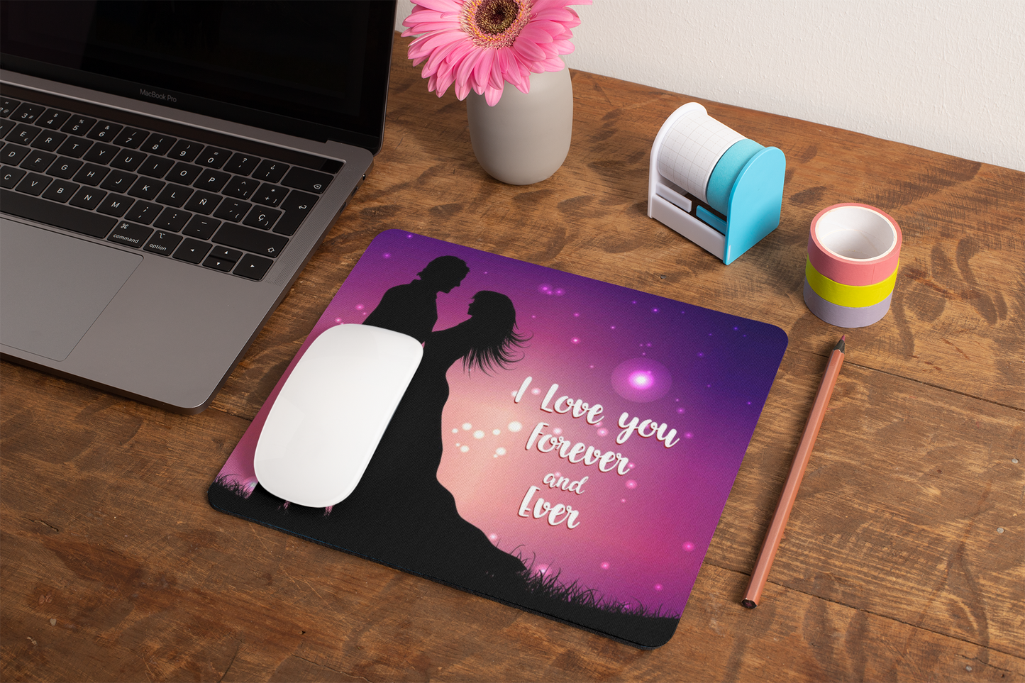 mockup-of-a-mousepad-lying-on-a-rustic-table-next-to-a-flower-vase-27554